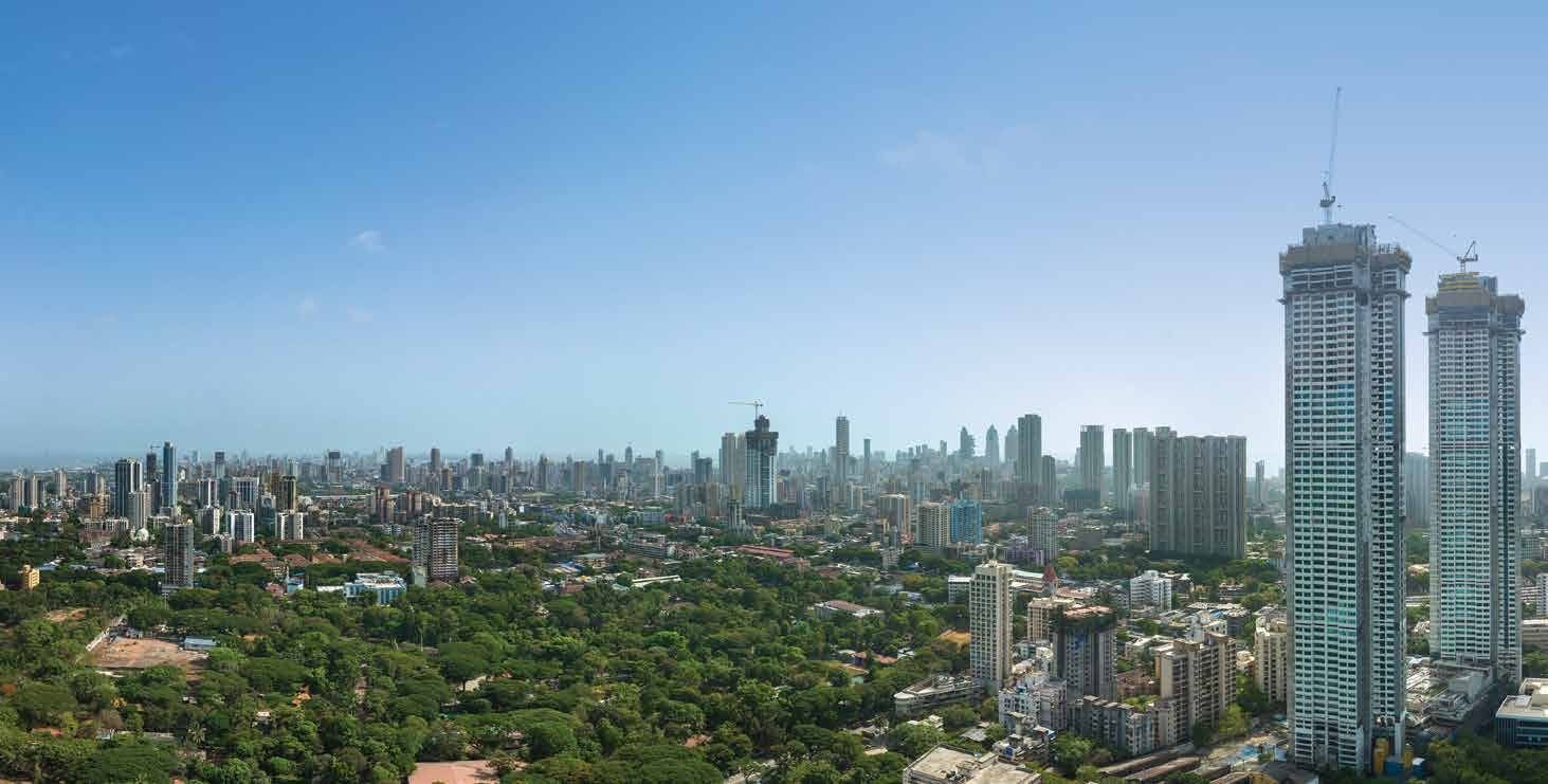 Actual westward view from the site over a green canopy towards the South Mumbai skyline